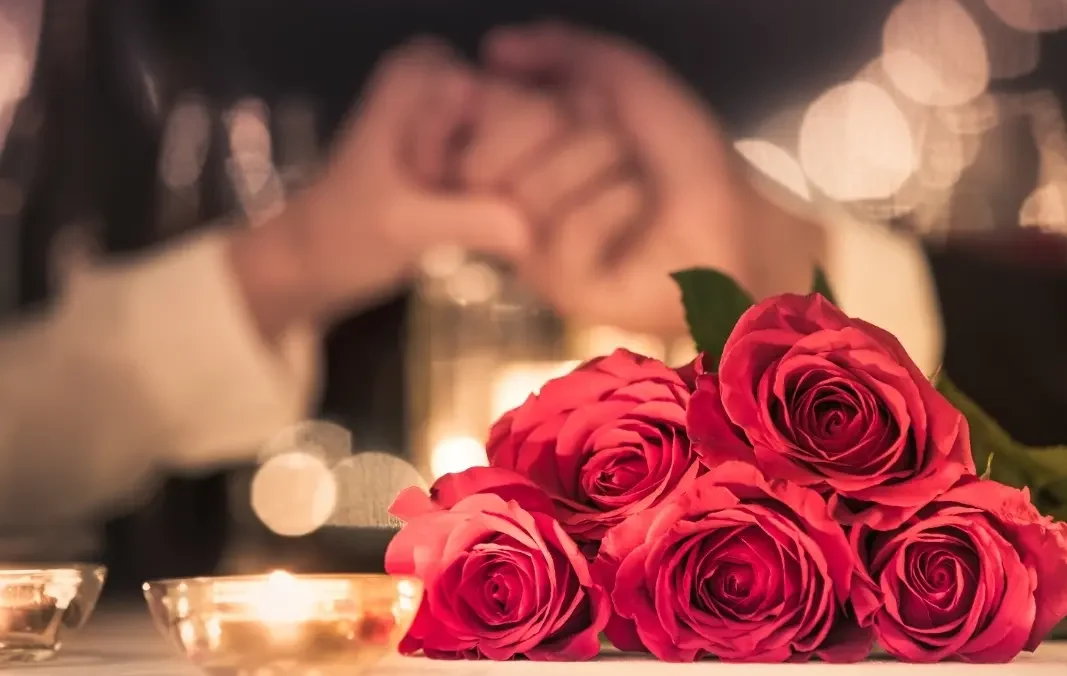 showing love in hotel with flowers to his wife